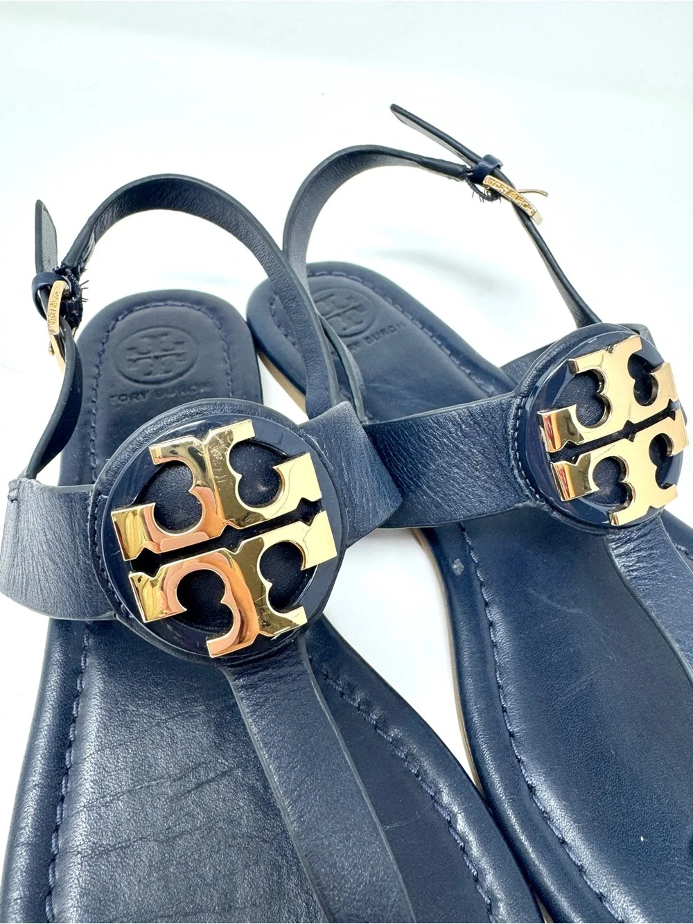 Tory Burch Bryce Navy Leather Logo Thong Sandals with Gold Logo Medallions
